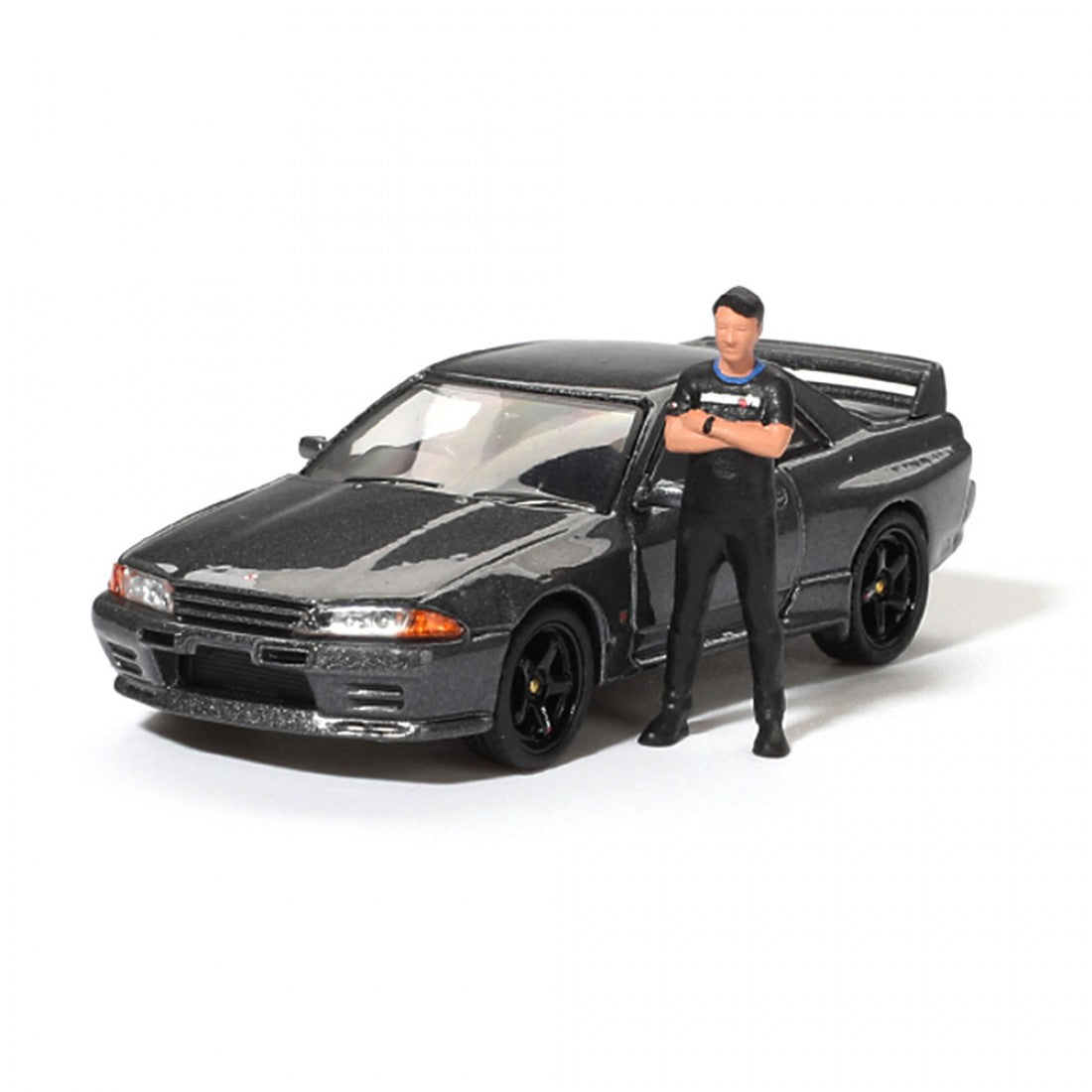 Mini GT 1:64 Nissan Skyline GT-R (R32) Nismo Gunmetal con figura